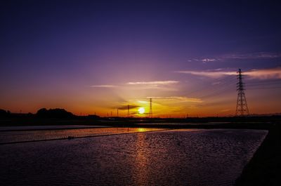 Electricity pylon at sunset