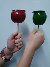 Close-up of hand holding strawberry