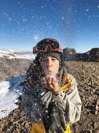 Full length of man on snowcapped mountain during winter