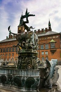 Statue of liberty against cloudy sky