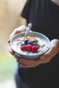 Midsection of woman holding food