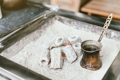 High angle view of ashes by drink