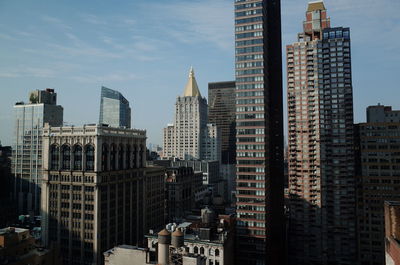 Modern buildings in city against sky