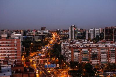 Cityscape against sky at dusk