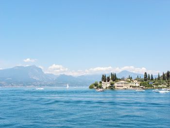Scenic view of sea against blue sky