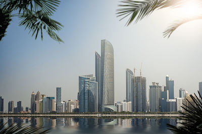 Modern buildings in city against clear sky