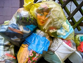 Mannequin with garbage in plastic bag 