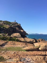 Scenic view of sea against clear blue sky