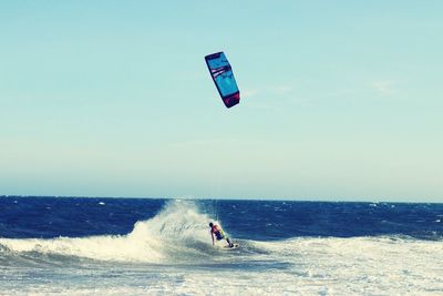 People surfing in sea