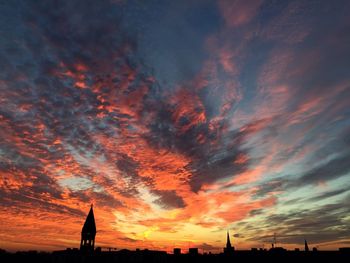 Silhouette of building during sunset