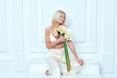 Portrait of woman holding bouquet