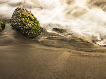 Close-up of water flowing through rocks