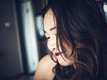 Close-up of young woman with black hair