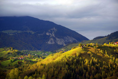 Scenic view of landscape and mountains against sky