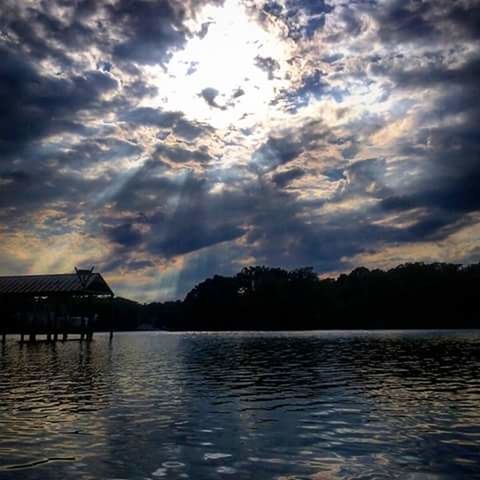 SCENIC VIEW OF LAKE AT SUNSET