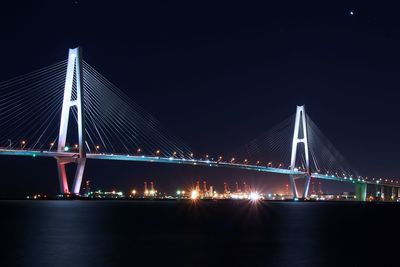 Illuminated suspension bridge at night