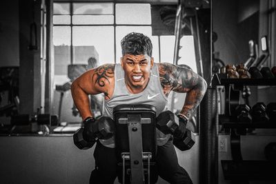 Low angle view of man standing in gym