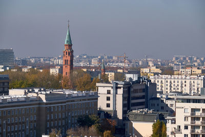 View of buildings in city against sky