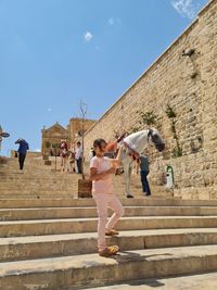 A child and a camel in mardin