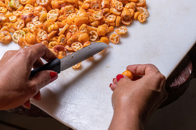 Cropped hands preparing food