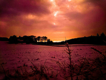 Scenic view of dramatic sky at dusk