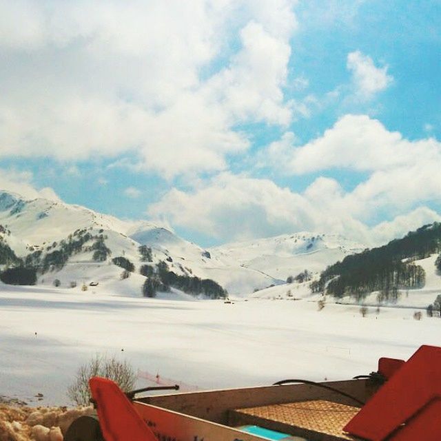 SCENIC VIEW OF SNOW COVERED MOUNTAINS AGAINST SKY