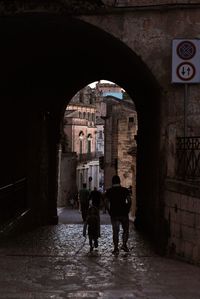 People walking on road in city