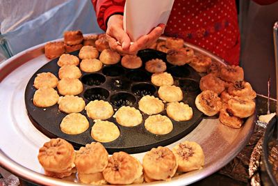 High angle view of person preparing food in market