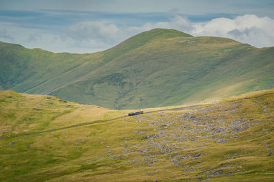 View from ranger path at llanberis path and mountain train to yr wyddfa peak - snowdon in wales. uk