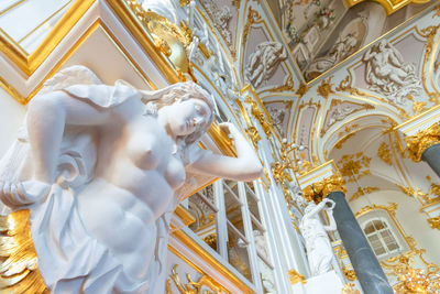 Low angle view of statue against building