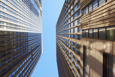 Low angle view of modern buildings against clear sky