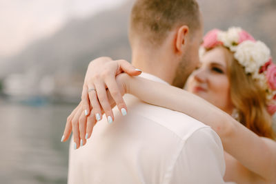 Close-up of couple embracing outdoors