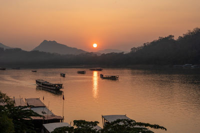 Scenic view of lake against sky during sunset