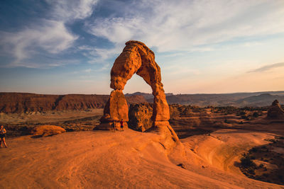 Rock formations on landscape against sky