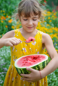 Portrait of boy eating food