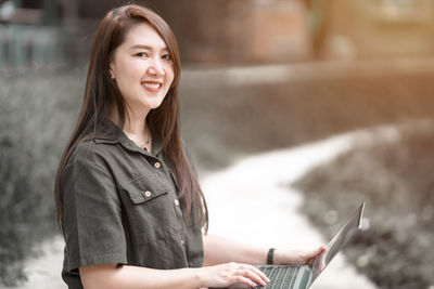 Young woman using mobile phone