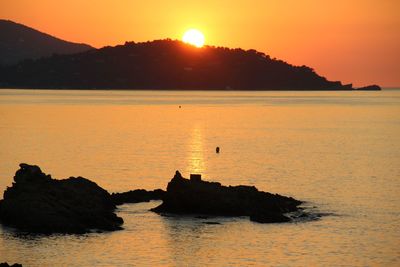 Scenic view of sea against sky during sunset