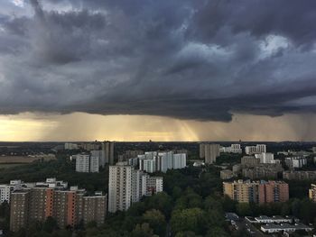 High angle view of city against cloudy sky