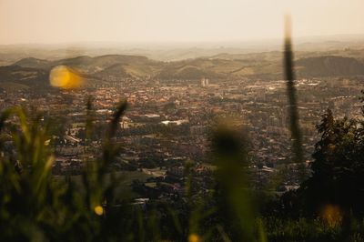 High angle view of city and buildings against sky