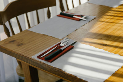 High angle view of place setting on wooden table