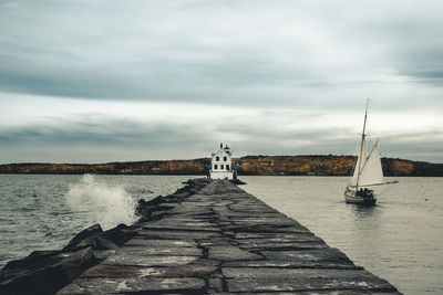 Pier over sea against sky