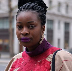 Portrait of young woman in city