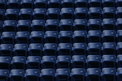 Full frame shot of empty chairs at stadium
