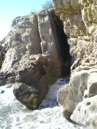 Close-up of rock against sky