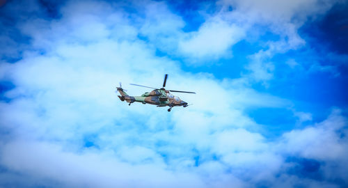 Low angle view of airplane against sky