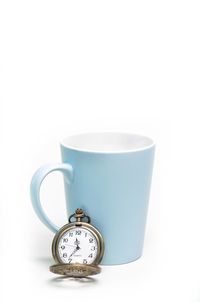 Close-up of clock against white background