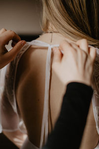 Hands of woman tying knot