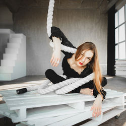 Low angle view of young woman working at home