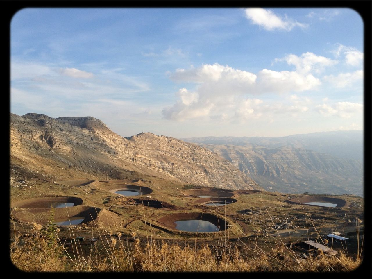 mountain, landscape, transfer print, sky, tranquil scene, tranquility, scenics, auto post production filter, mountain range, nature, beauty in nature, cloud - sky, non-urban scene, cloud, remote, horizon over land, day, outdoors, no people, hill