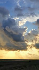 Scenic view of sea against sky at sunset